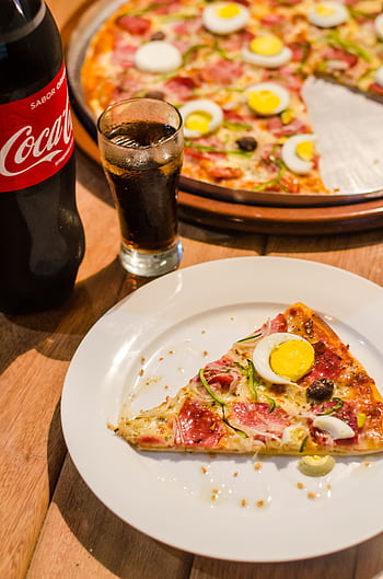 Delicious pizza with eggs and olives, paired with a refreshing cola drink. Perfect for dine-in or casual dining. HD phone wallpaper