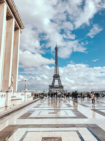 A scenic view of the Eiffel Tower in Paris with tourists on a sunny day. Captured from Trocadéro plaza. HD phone wallpaper