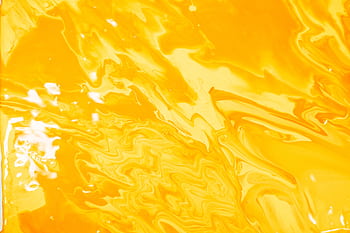 Abstract acrylic painting in vibrant yellow with swirling patterns and textures. HD wallpaper
