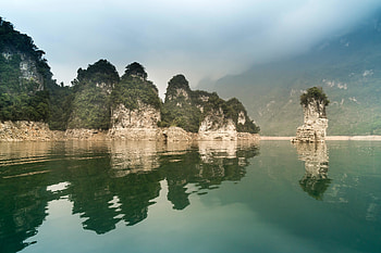 Body of water, cliffs, rocks HD wallpaper