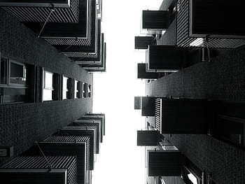 Low angle shot of modern black and white city apartments with balconies. HD wallpaper