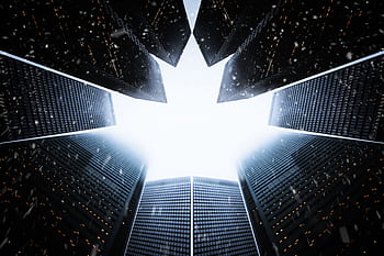 A striking low angle view of skyscrapers forming a maple leaf shape against the sky. HD wallpaper