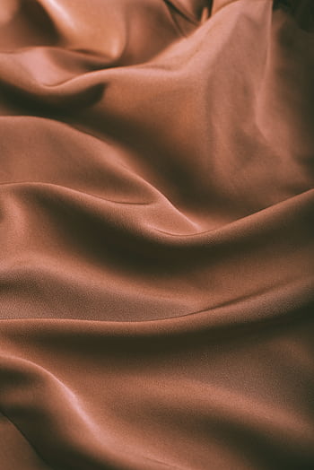 Smooth brown satin fabric flowing gently, capturing light, soft texture. HD phone wallpaper