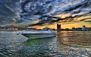 Leaving The City Behind, boat, colorful, colors, peaceful, houses, beauty, buildings, leaving, reflection, boats, ocean, sunset, sea, architecture, city, house, beautiful, building, view, clouds, sailing, nature, sky, lovely, splendor HD wallpaper