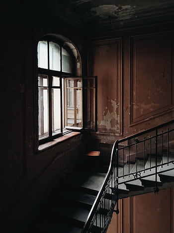 Dimly lit abandoned stairwell with vintage architecture and open window. HD phone wallpaper