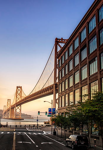 Stunning view of the Bay Bridge from downtown San Francisco at sunrise. HD phone wallpaper