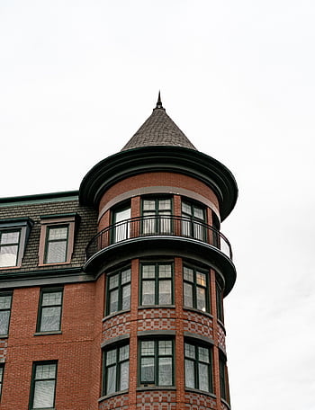 Close-up of a Victorian building's turret showcasing classic architectural design. HD phone wallpaper