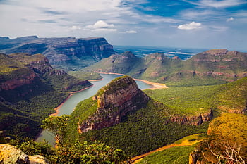 Explore the breathtaking vistas of Blyde River Canyon with dramatic cliffs and lush greenery. HD wallpaper