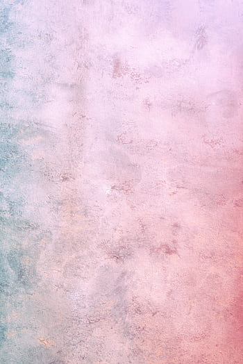 A textured wall with a subtle gradient of pink and blue tones, perfect for design and decor. HD phone wallpaper