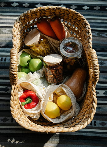 Discover a selection of fresh, organic produce in a wicker basket, promoting eco-friendly shopping. HD phone wallpaper