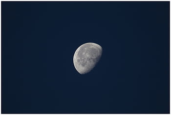 Captivating of the moon against a dark night sky, perfect for space enthusiasts. HD wallpaper