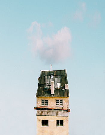 A minimalist graph of a tall, simple urban tower against a clear blue sky with clouds. HD phone wallpaper