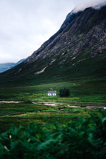 Explore the serene highlands of Scotland with a que valley and white house. HD phone wallpaper
