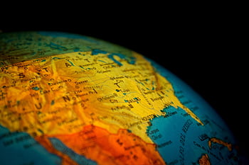 Vibrant close-up of a globe displaying North America in detail, highlighting the USA. HD wallpaper