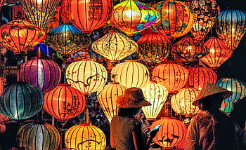 Vibrant lanterns light up the night during a traditional Asian celebration. HD wallpaper