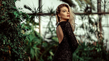 Blonde Girl Model Is Wearing Black Glitter Dress Standing In Blur Green Plants Background Girls HD wallpaper