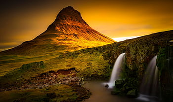 Beautiful view of Kirkjufell Mountain in Iceland with cascading waterfalls at sunset. HD wallpaper