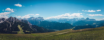 Captivating view of majestic mountains under a vibrant blue sky. HD wallpaper