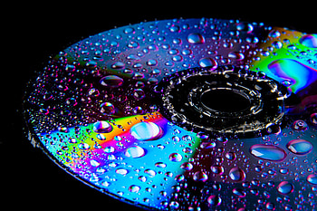 Disk, wet surface, drops, colorful, reflections HD wallpaper