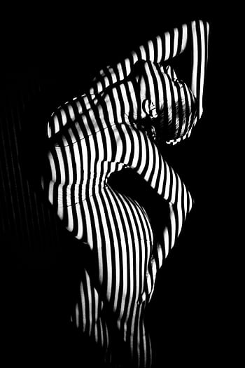 Black and white artistic of a woman with shadow stripes creating abstract patterns. HD phone wallpaper