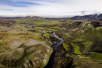 A breathtaking aerial shot capturing the vast, lush landscapes of Iceland's highlands. HD wallpaper