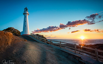 Castlepoint Lighthouse in New Zealand, New Zealand, lighthouse, ocean, sunrise, beach HD wallpaper