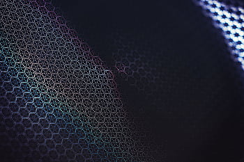 Futuristic abstract design with a dark geometric hexagonal pattern and creative color gradients. HD wallpaper