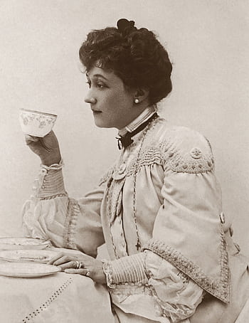 Elegant Victorian woman sipping tea in a vintage sepia-toned portrait. HD phone wallpaper