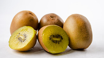 Golden kiwi fruit, Harvested treasure, Fruit crate, Fresh produce HD wallpaper
