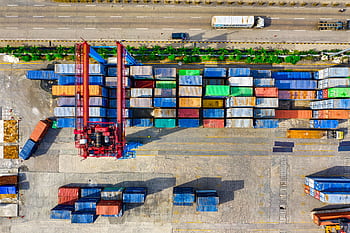 Colorful cargo containers organized at a shipping yard in North Jakarta, Indonesia. HD wallpaper