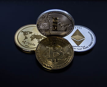 Detailed showcasing bitcoin, ethereum, litecoin, and ripple coins representing digital currency. HD wallpaper