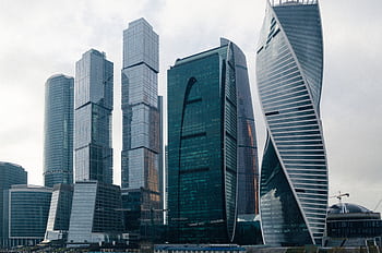 Aerial view of modern skyscrapers in Moscow, showcasing futuristic architecture and urban expansion. HD wallpaper
