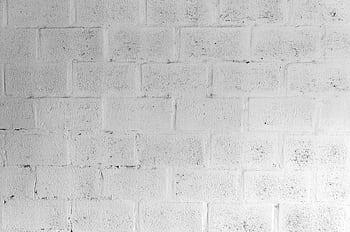 A textured white brick wall for use in design and architectural projects. HD wallpaper