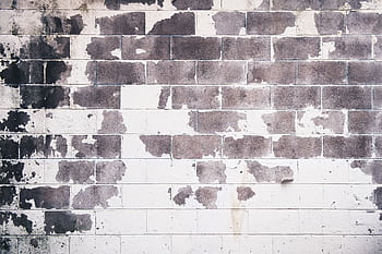 Detailed grunge texture of an old brick wall with peeling paint and rustic feel. HD wallpaper