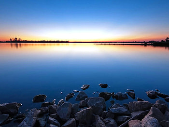 Amazing Sunset Background, horizon, blue, black, awesome, graphy, coast, , reflections, nice, background, seascape, trees, amazing, sun, sea, sunsets, reflected, sunrises, lagoons, beautiful, orange, rocks, stones, lakes, pink, hop, yellow, cool, nature, sky, rivers HD wallpaper