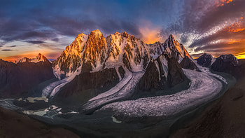 Glowing cliffs, mountains, sunset HD wallpaper