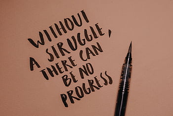 Handwritten motivational quote using a brush pen on a textured background for inspiration. HD wallpaper