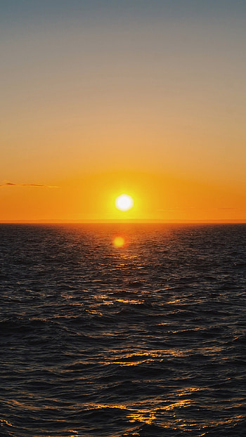 Stunning sea sunrise, Tranquil nature scene, Mesmerizing colors, Calm waves HD phone wallpaper