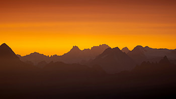 Sun Setting Over A Mountain Range, sun, sunset, mountains, mountain, nature HD wallpaper
