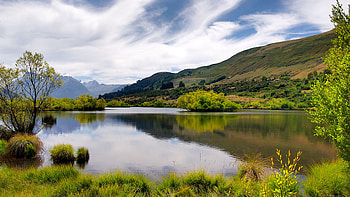 Bushes, Grass, Field, River, Reflection, Hill, Mountain, Clouds, Slope, Sky Nature HD wallpaper