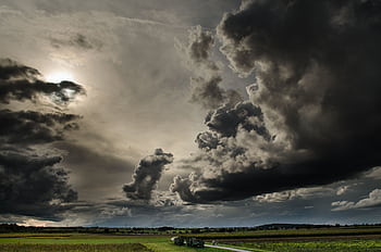 Dramatic dark clouds over a scenic countryside in Rottenburg am Neckar, Germany. HD wallpaper