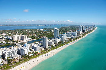 Stunning aerial view of Miami Beach's skyline along the Atlantic Ocean, ideal for travel and adventure ry. HD wallpaper