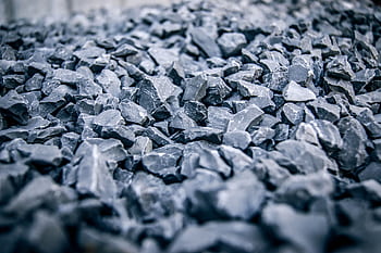 Detailed view of jagged grey stones, highlighting texture and natural pattern. HD wallpaper