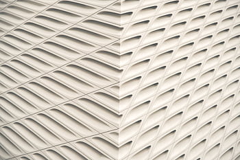 Symmetrical architectural facade with a modern geometric pattern, ideal for design inspiration. HD wallpaper