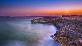 Lighthouse Sunset Rocky coast HD wallpaper
