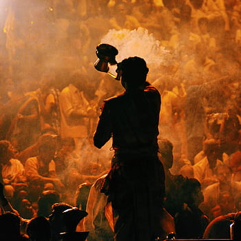 A vibrant Hindu prayer ritual with incense smoke in Mumbai, highlighting spirituality and community. HD phone wallpaper