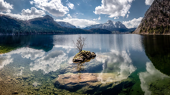 Landscape View Of Mountains With Snow Trees Bushes Slope Rocks Under White Clouds Blue Sky Reflection On Lake Nature HD wallpaper