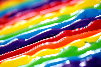 A vibrant abstract background featuring flowing rainbow colors in a creative artistic style. HD wallpaper