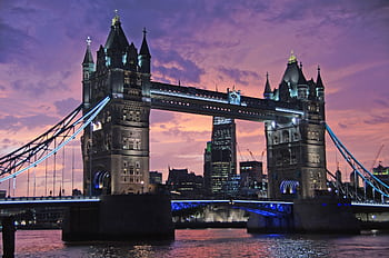 Iconic Tower Bridge in London against a stunning sunset sky. Perfect for travel and architecture themes. HD wallpaper