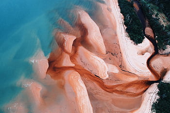 Stunning aerial view of Chukai's vibrant, sandy seashores blending into the ocean. HD wallpaper